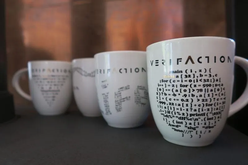 VerifAction mugs printed with obfuscated C programs